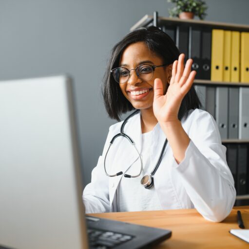 Portrait Of Smiling Female Doctor Wearing White Coat With Stethoscope In Hospital Office. Portrait Of Smiling Female Doctor Wearing White Coat With Stethoscope In Hospital Office