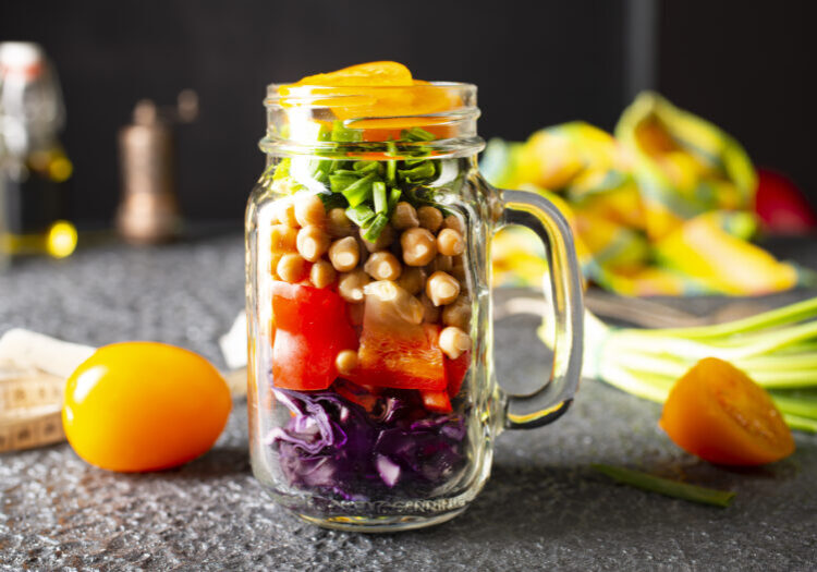 Vegetable salad with chickpeas and red cabbage. Salad in glass bank